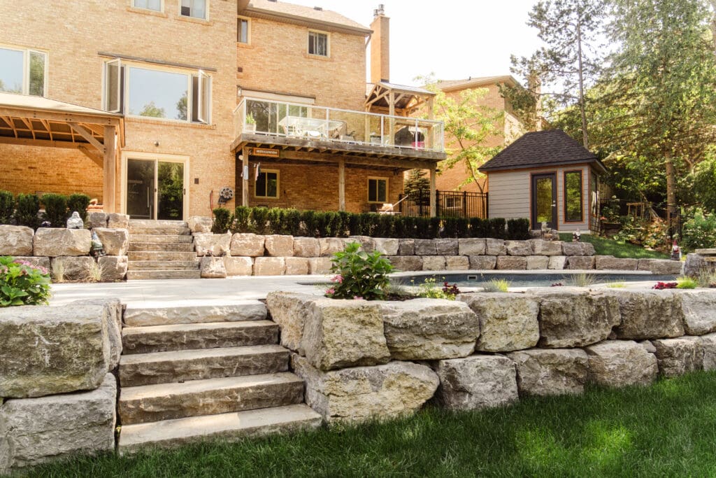 Armour stone retaining wall with natural stone steps
