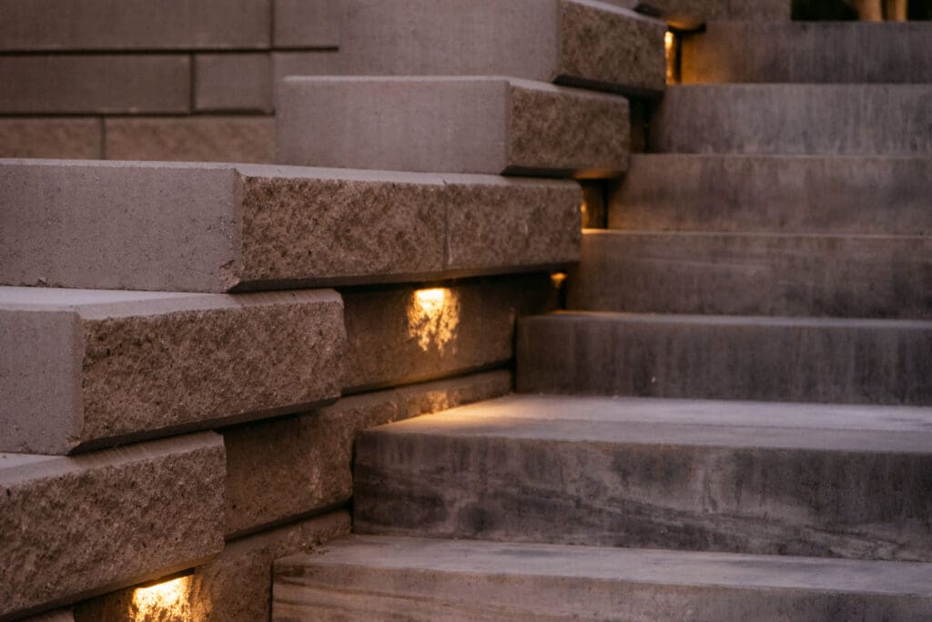 Stone steps with integrated lighting in a hardscape project