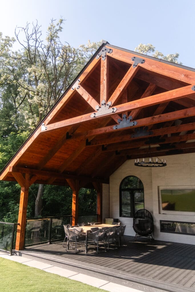 Timber-frame gazebo with vaulted ceiling and covered outdoor dining area